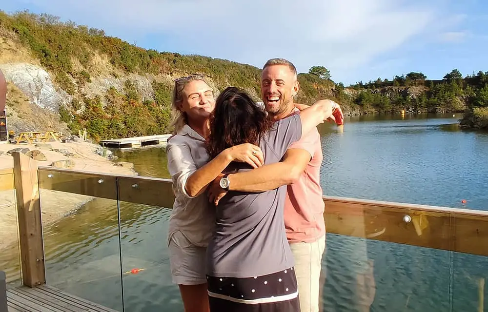A hug between CST staff and the filming team