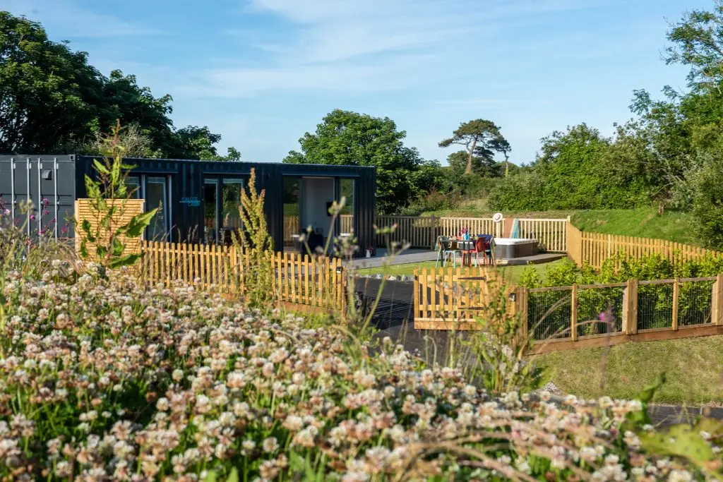 Calcite Cabin exterior with enclosed garden and hot tub